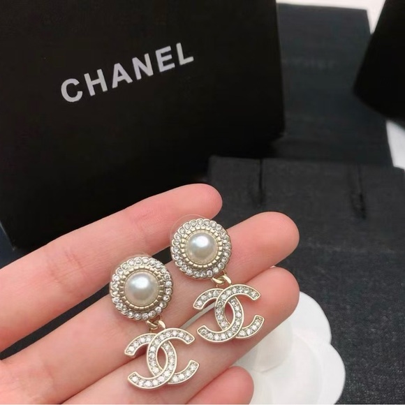 CHANEL. Jewelry - Chanel's classic double C pearl studded earrings